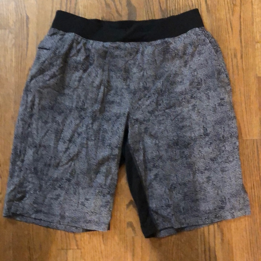 Lululemon men’s shorts. Elastic waist shorts. Black and gray in color.